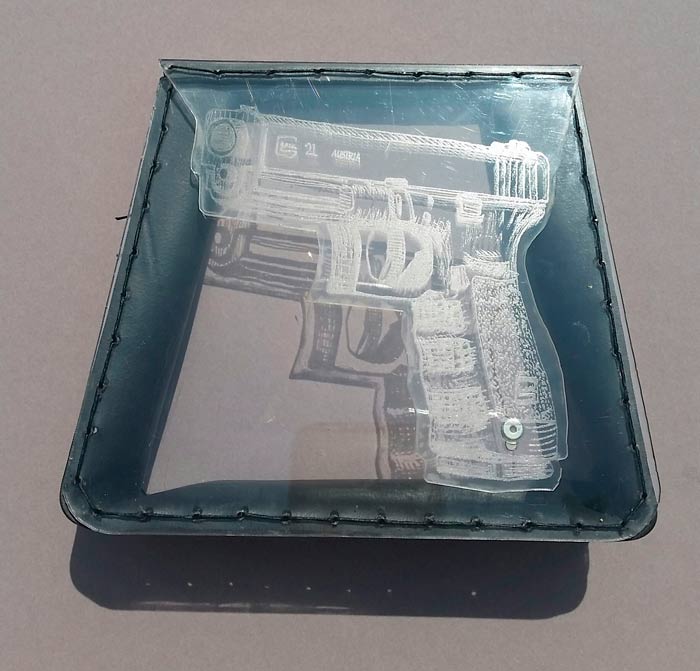 aug16-mann-glockclutchview2-700wi