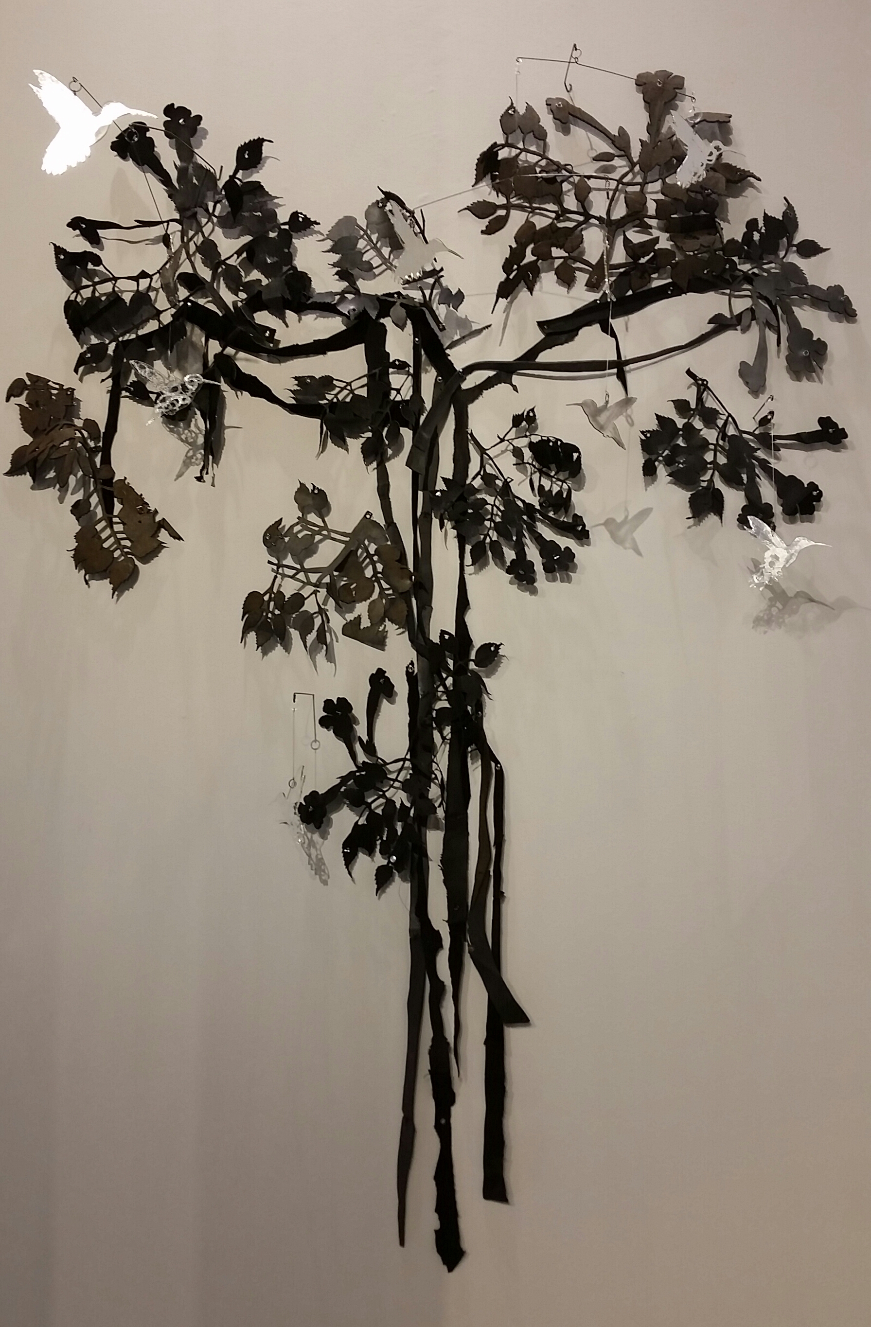 Valerie Mann, The Persistence of Hummingbirds, 65 x 37 x 10", acrylic, silver leaf, steel wire, rubber, leather, eyelets