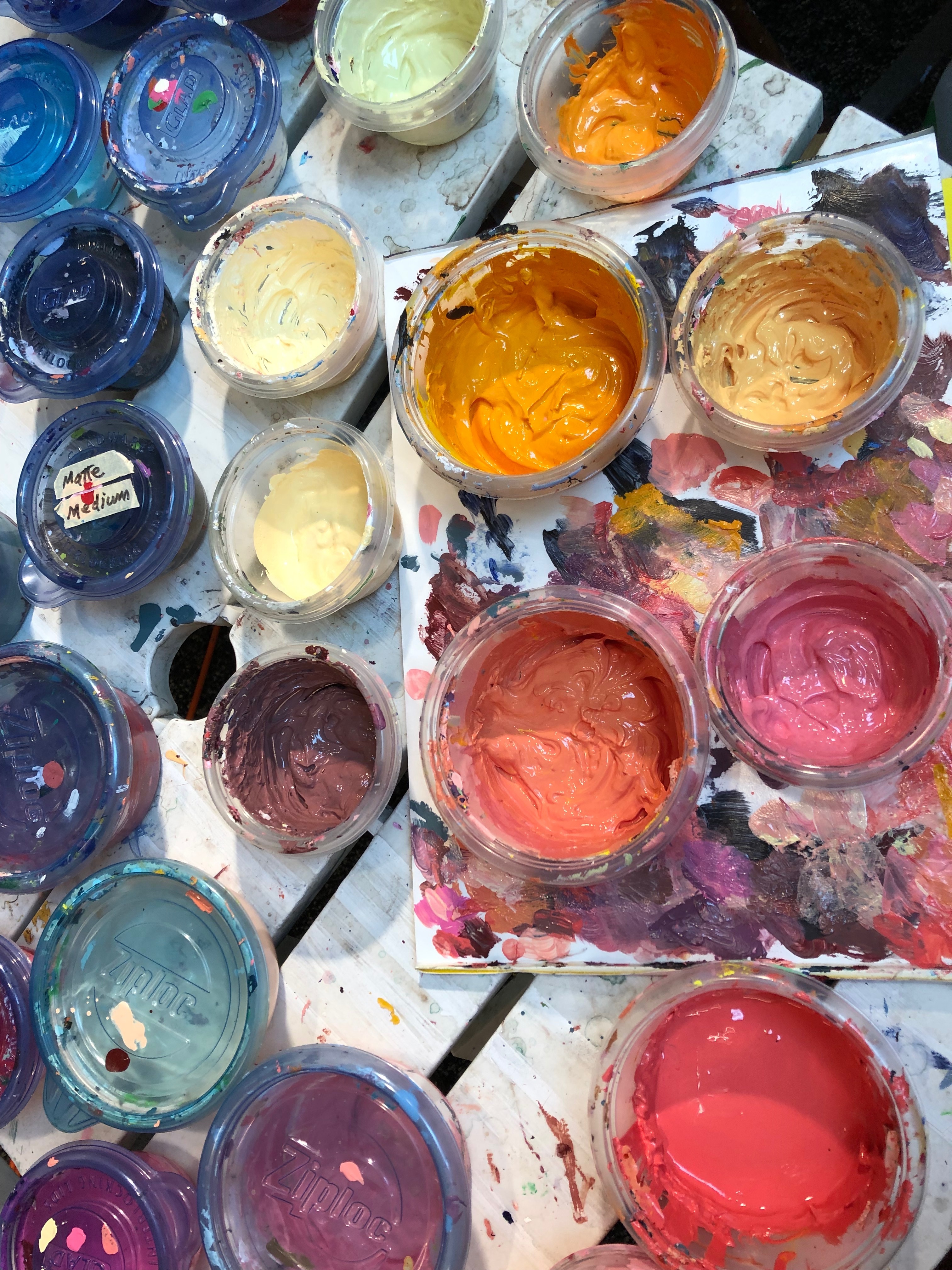 containers of mixed acrylic paint in Kaplan's studio